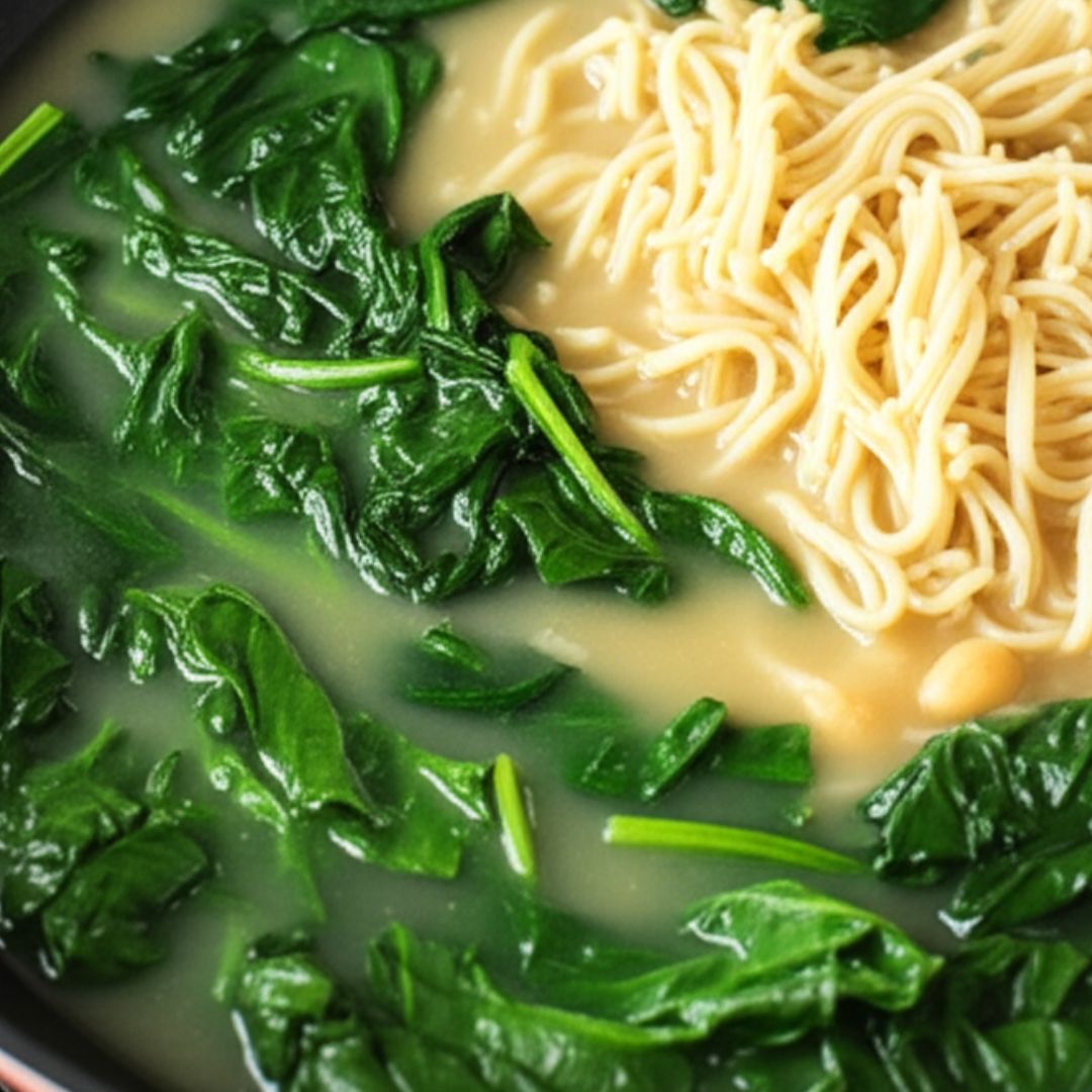 Easy Chickpea Noodle Soup Recipe (Easy + Vegan + One-Pot Meal) 15 Stirring spinach into noodle soup for added nutrition