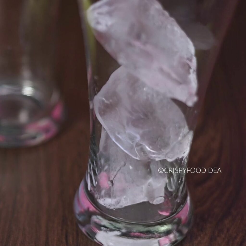 Add ice cubes into the glass