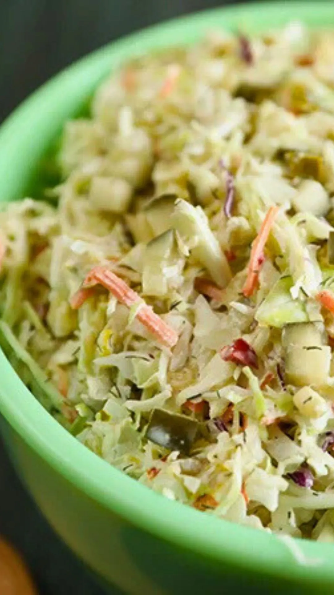 Dill pickle coleslaw with chopped pickles and dill