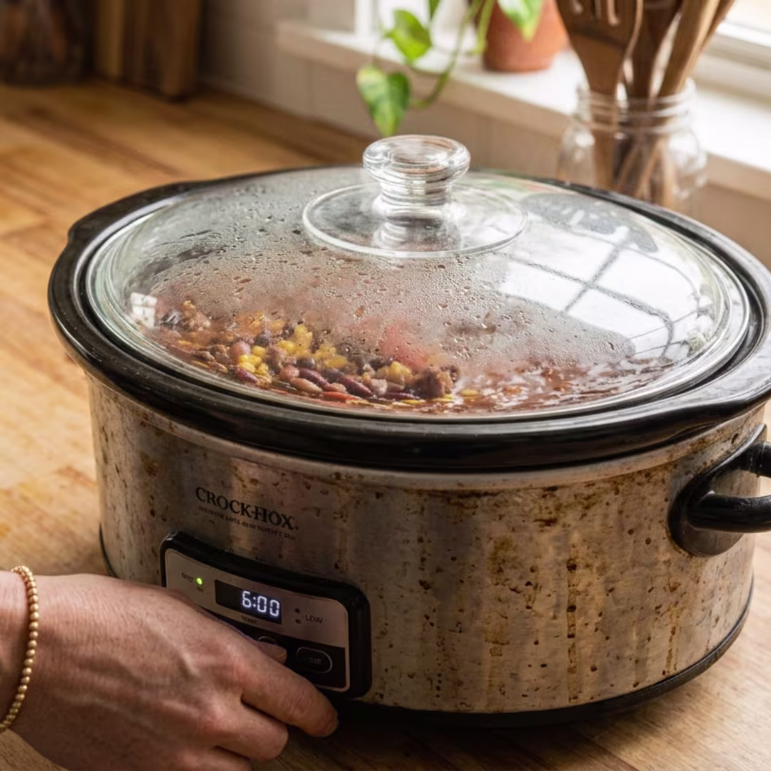 Taco rice soup ingredients cooking together in a crockpot